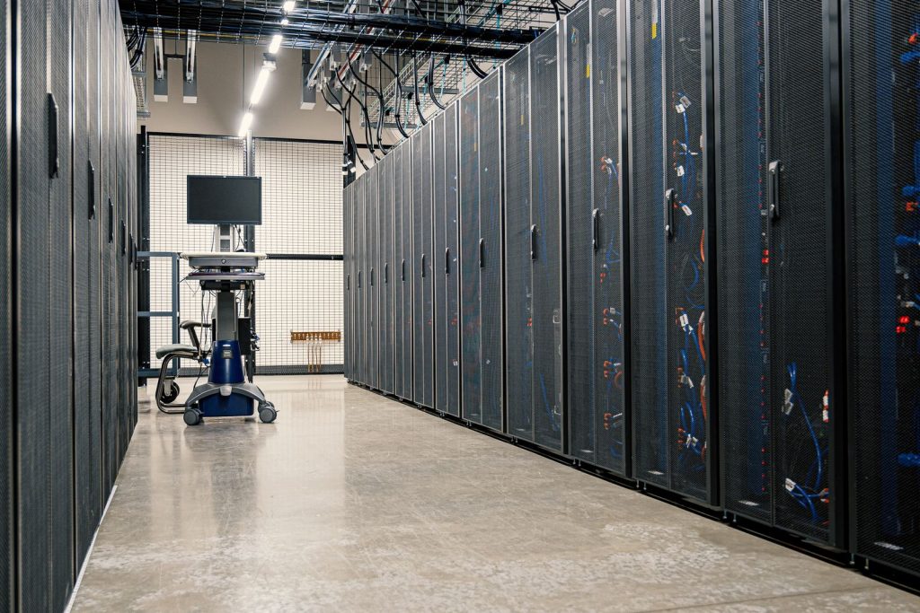Rows of enterprise firewall and network server racks in a data center