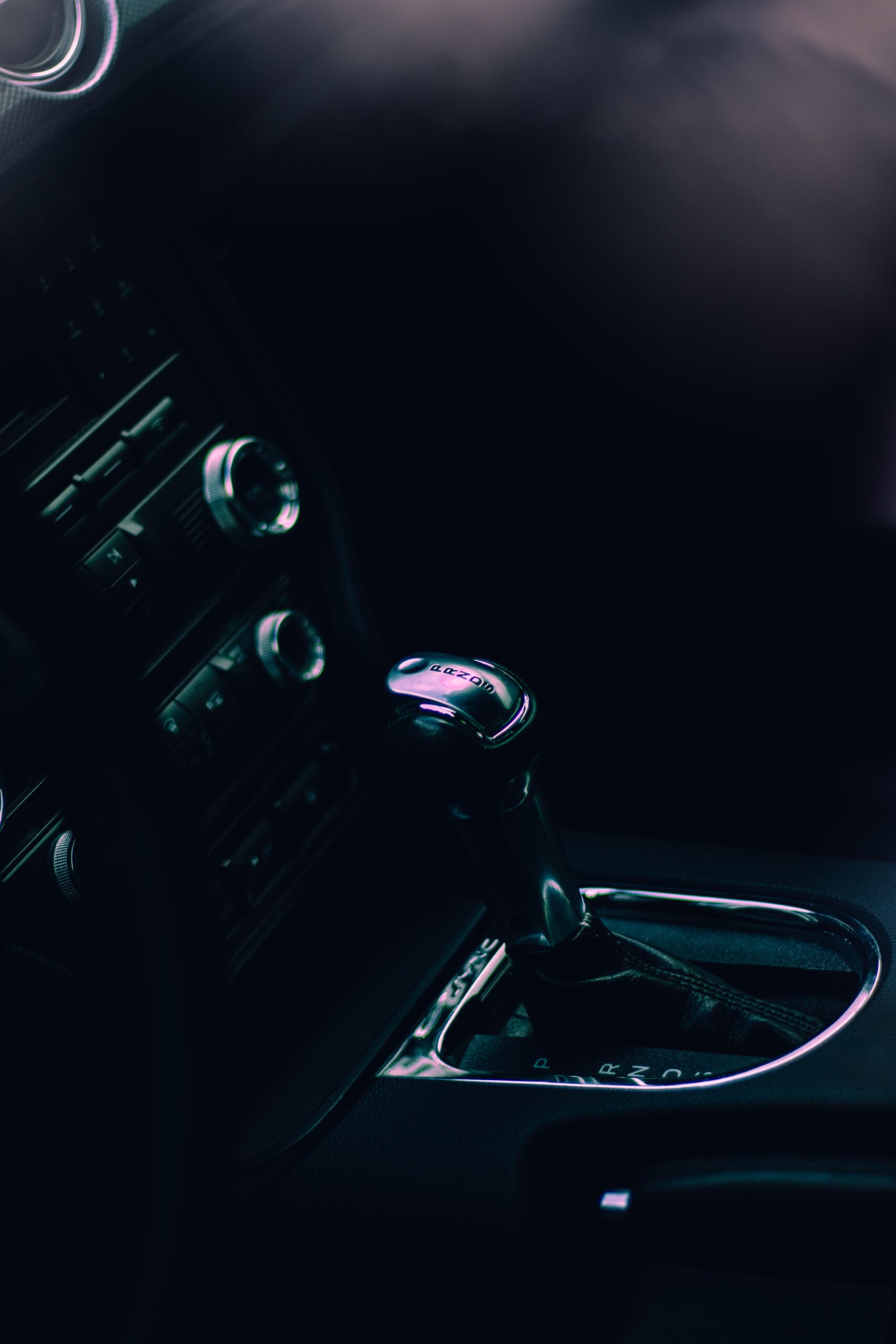 Close-up of a car's manual gear shift lever