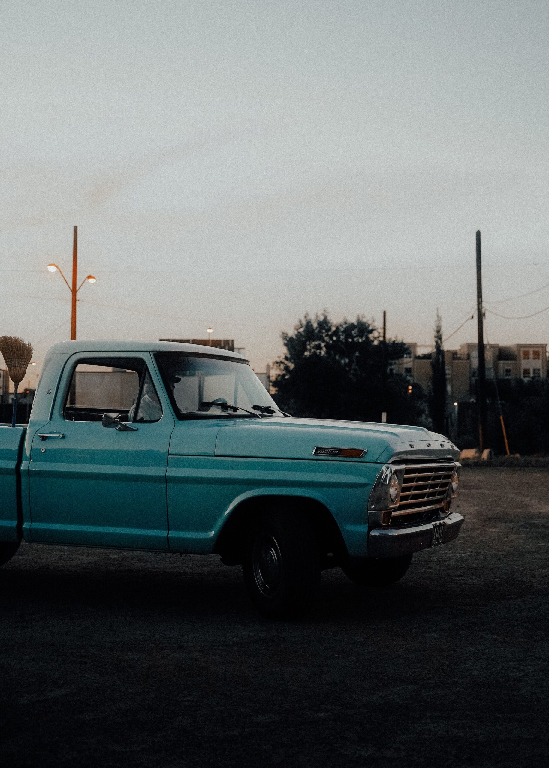 Classic single-cab pickup truck parked at dusk