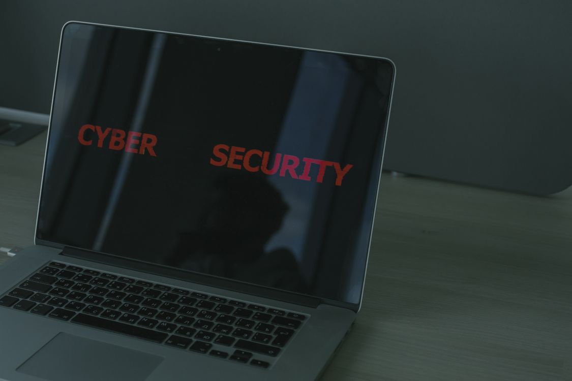 Laptop displaying cybersecurity text representing firewall vulnerabilities 2026 patch response